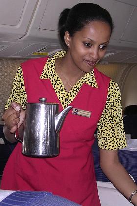 Flight attendant Helen serving coffee on the flight to Asmara.