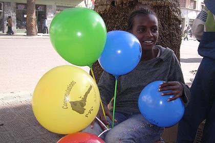 Congratulations - boy selling balloons on the occasionof 14th Independence Day - Asmara Eritrea.