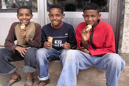 Boys enjoying ice cream - Harnet Avenue - Asmara Eritrea.