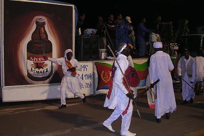 Men of various ethnic groups, singing and displaying traditional dance. Celebrations of 14th Independence Day - Bathi Meskerem Asmara Eritrea.