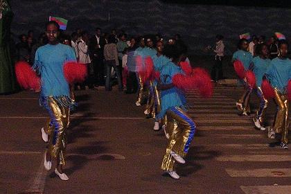 Girls of the Asmara University giving a street show on African drum beats. Celebrations of 14th Independence Day - Bathi Meskerem Asmara Eritrea.