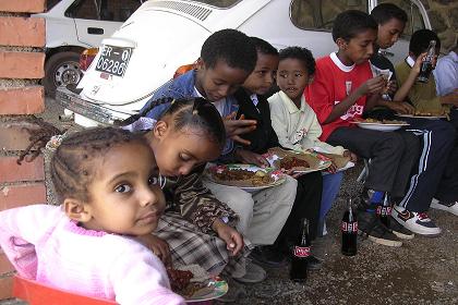 Children having lunch for the Asmara Palace residentional building.