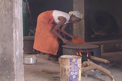 Woman making Suwa - Adi Guadad Asmara Eritrea.