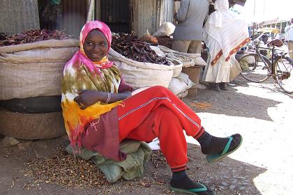 Young woman selling chilli - Medeber markets Asmara Eritrea.