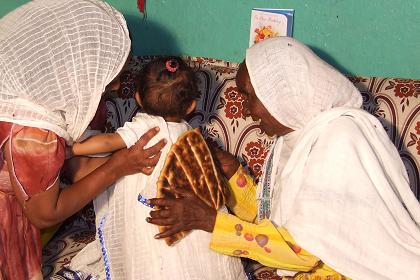 Breaking the hembesha on Naomi's back - Sembel Asmara Eritrea.