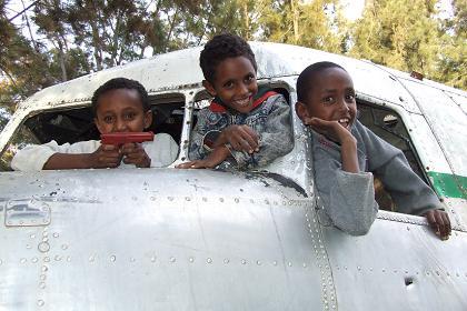 Children playing in an old Dakota - Expo grounds Asmara Eritrea.