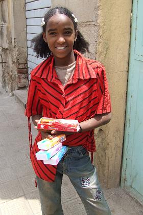 Young girl selling handkerchiefs and chewing gum - Asmara Eritrea.