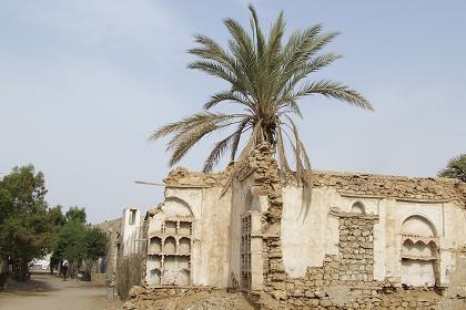 Carved interior shelving of a residential house in the port district, destructed during the 1961 - 1991 struggle for Eritrean independence - Massawa Eritrea.