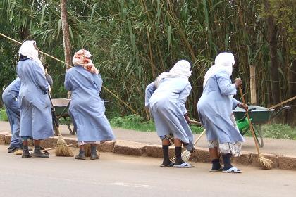 Women cleaning the streets - Airport Road Asmara Eritrea.