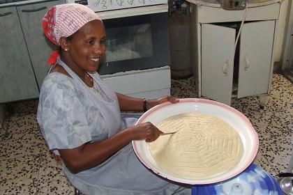 Aster making Hembesha (traditional bread) - Asmara Eritrea.