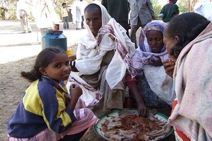 Local people sharing a traditional meal - Mendefera Eritrea.