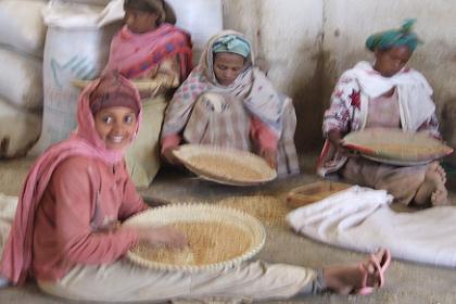 Women refining grains - Barentu Street Asmara Eritrea.