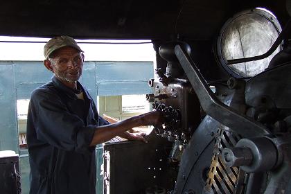 The loco man in his cabin - Eritrean Railways Asmara Eritrea.