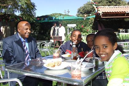 Mr. Solomon (hotel manager of the Embassoira Hotel) and his family.