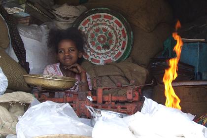 Young girl selling spices - Medeber markets Asmara Eritrea.