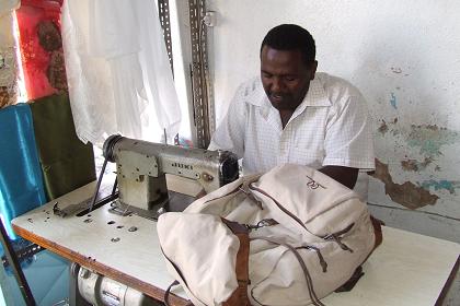 Ali repairing my rucksack - Asmara Eritrea.