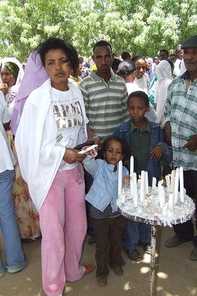 Bisrat burning a candle - Festival of Mariam Dearit - Keren Eritrea.