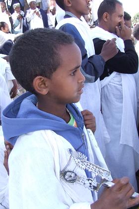 Young boy with sistrum. Nigdet Saint Georgis Orthodox Church - Gejeret Asmara Eritrea.
