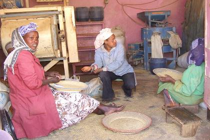 Women refining grains - Medeber Asmara Eritrea.