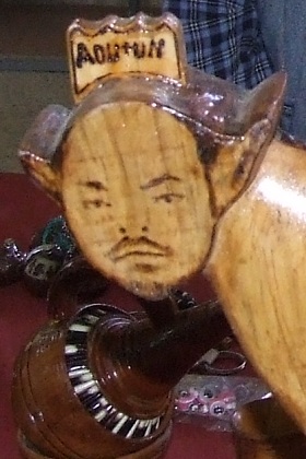 Meles Zenawi (Prime Minister of Ethiopia) crowned for his role in the African Union and UN.  Wood carving by an Eritrean Meles Zenawi worshipper.