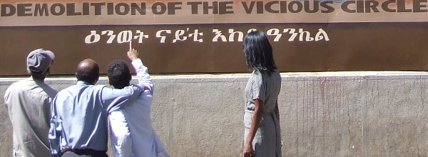 Eritreans evaluating the wall painting at the Ministry of Education.