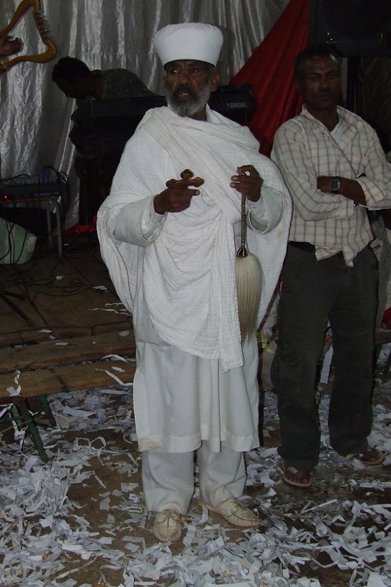 Priest blessing the wedding feast - Edaga Arbi Asmara.