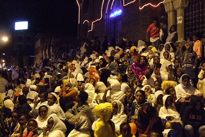 People gathered on the steps of the Cathedral - Harnet Avenue Asmara Eritrea.