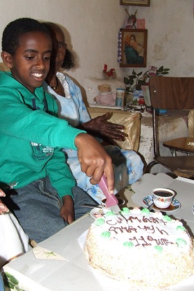 Yosief slicing his birthday cake - Asmara Eritrea.